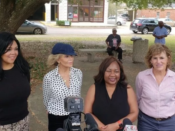 Kat Taylor, Jane Fonda and Khaliah Ali Join Board of The Center for Rural Enterprise and Environmental Justice, stand in front of microphones answering questions.